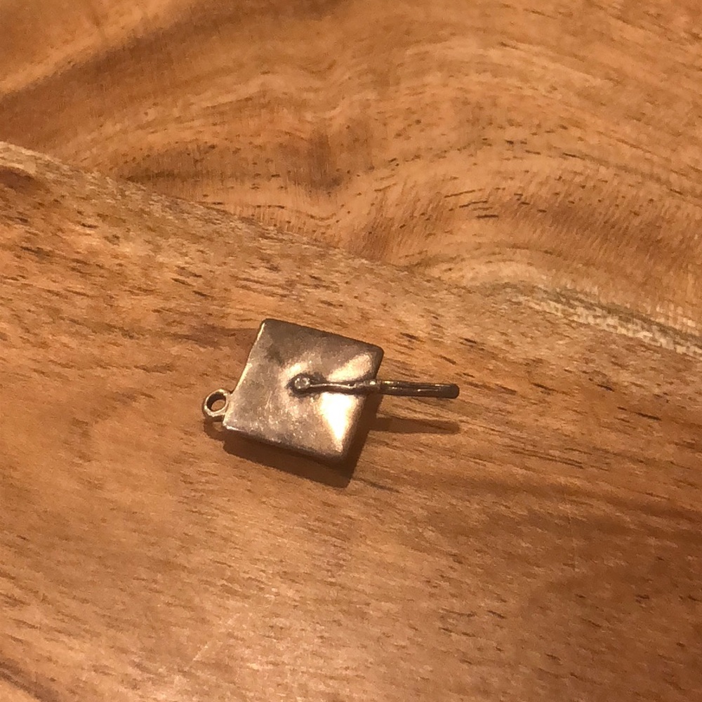 Retired James Avery graduation cap charm